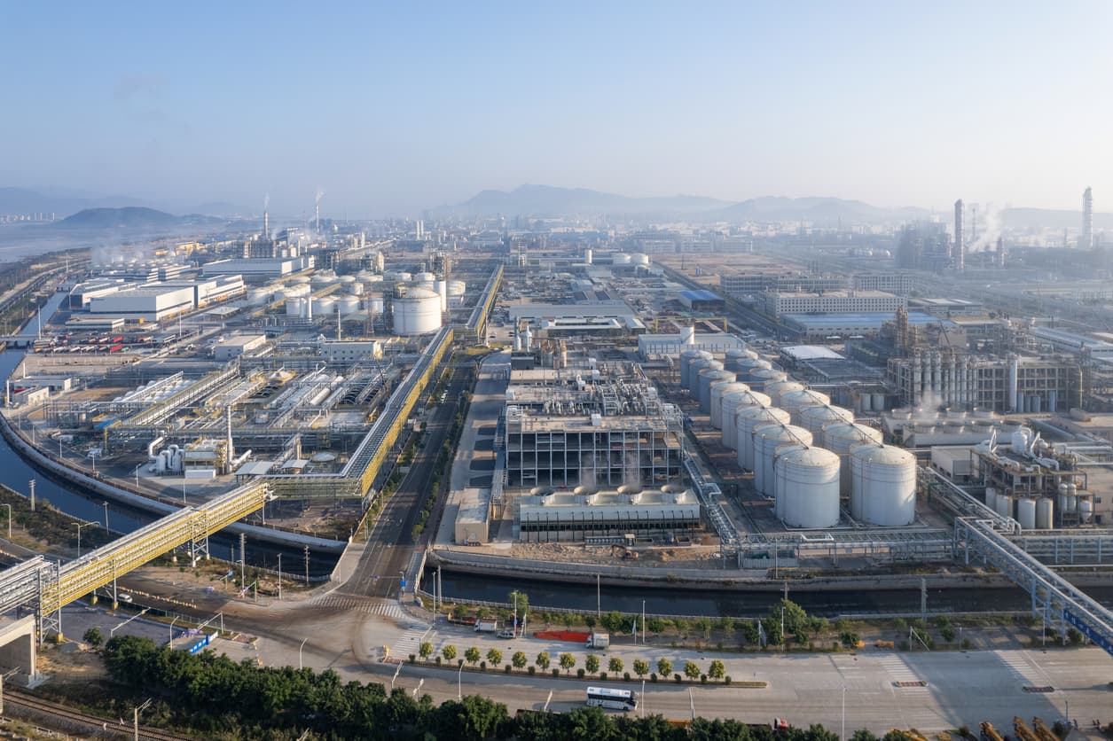 Aerial view of conveying equipment and storage tanks in a chemical plant