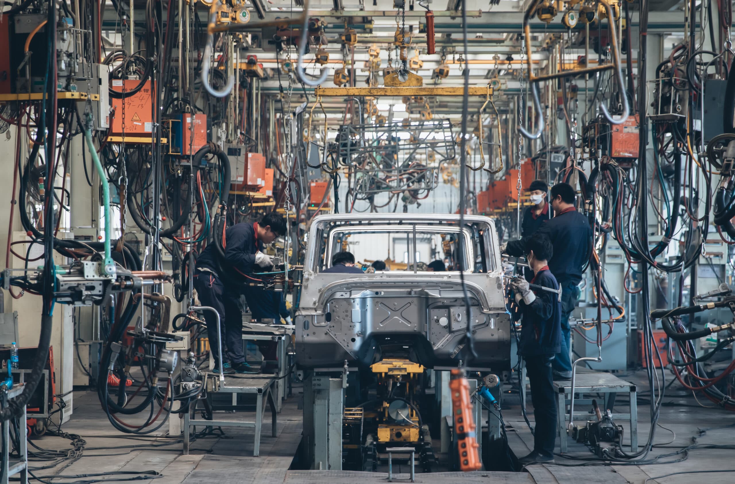 Workers in an automoble factory in Beijing,China.