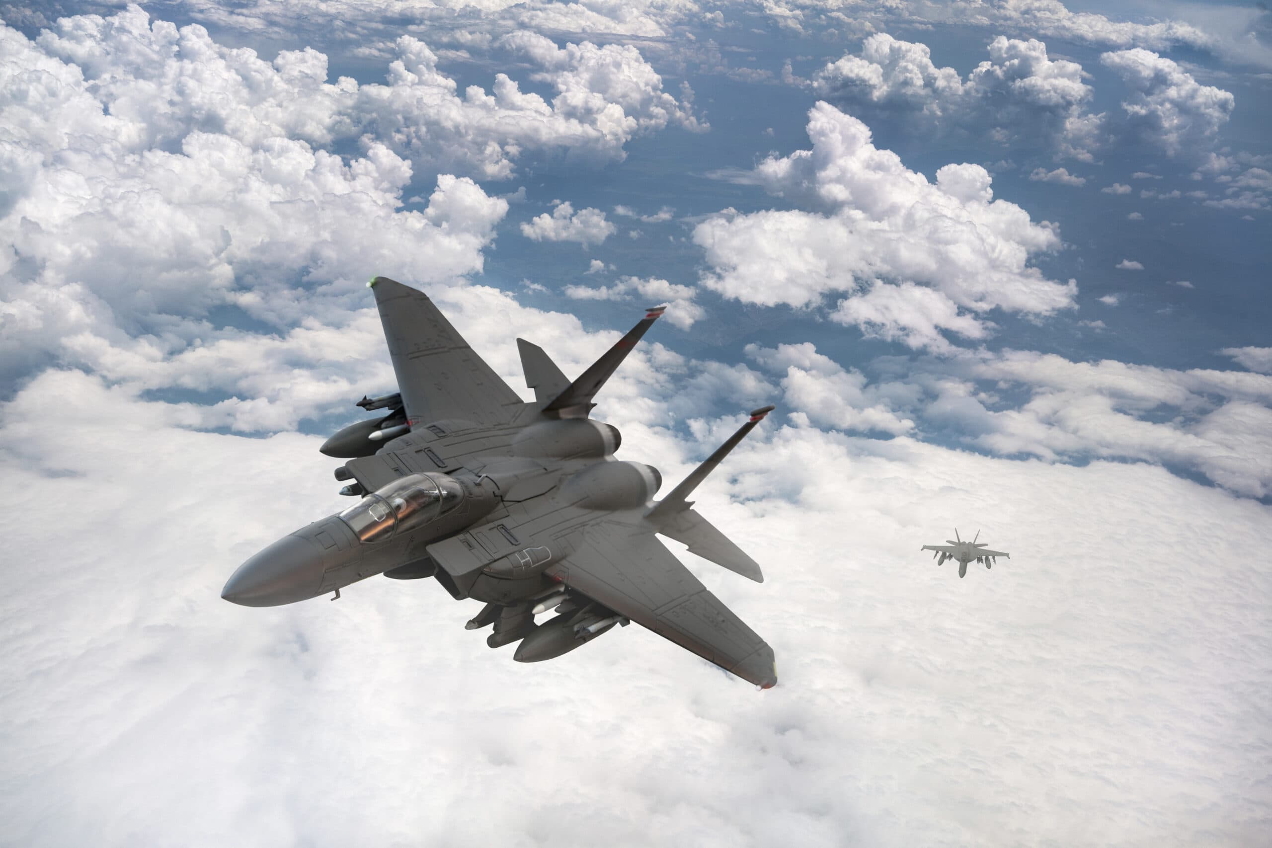 Jet fighters flying over the clouds.